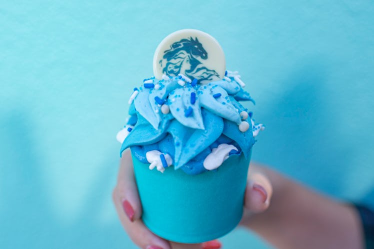 The Frozen Fractals Cupcake with white and blue frosting is available at Disney in celebration of 'F...