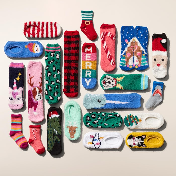 An assortment of Old Navy's fuzzy holiday-themed cozy socks on sale for $1 each.