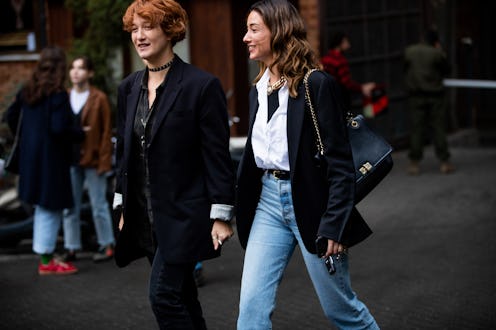 A girl walking and wearing jeans
