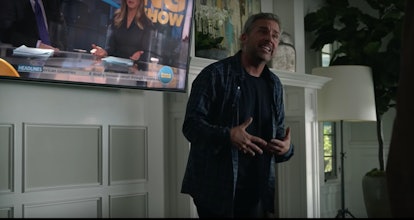 Steve Carell, starring as Mitch Kessler in The Morning Show, standing in front of a TV screen.