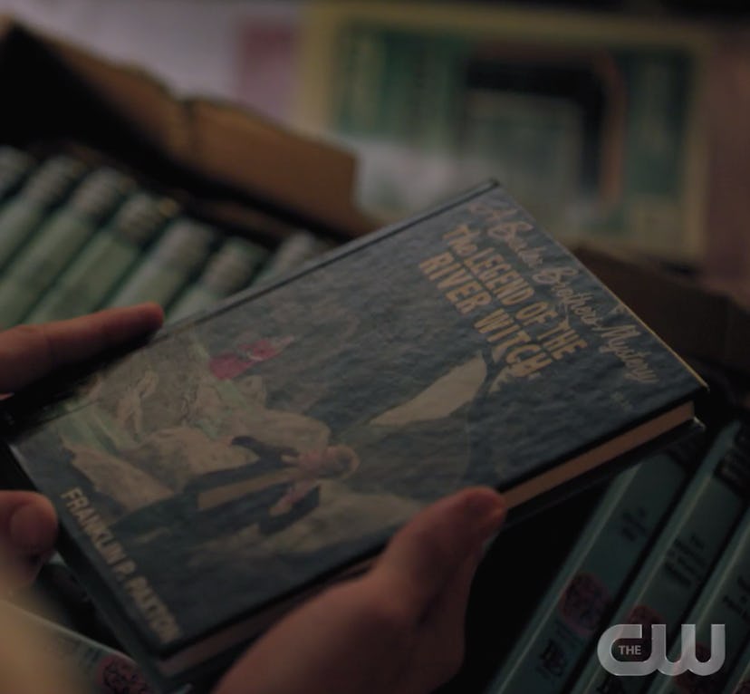 Jughead holding a Baxter Brothers book on Riverdale