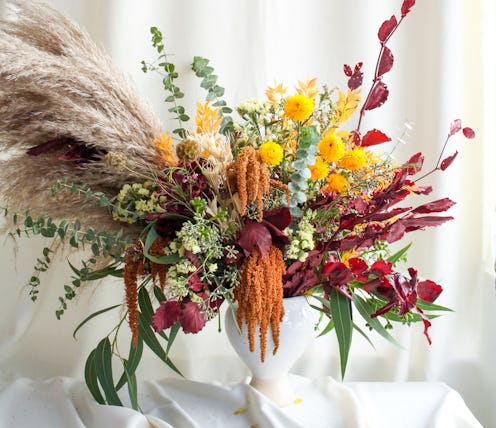 Dried flowers make floral arrangements for fall dinner parties much more versatile