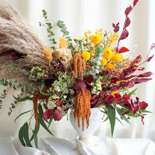 Dried flowers make floral arrangements for fall dinner parties much more versatile
