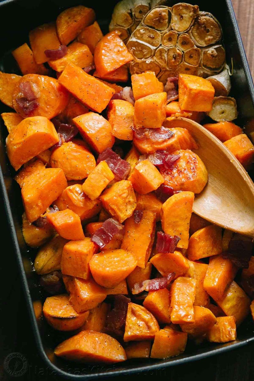 Easy Thanksgiving dishes; pan of maple roasted sweet potatoes with bacon
