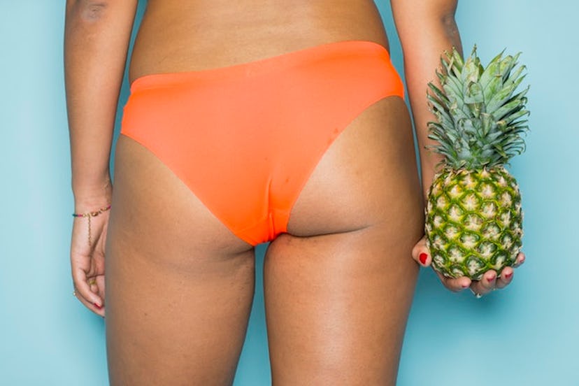 A woman in orange underwear holding a pineapple. Bidets may have health benefits for cleaning your a...