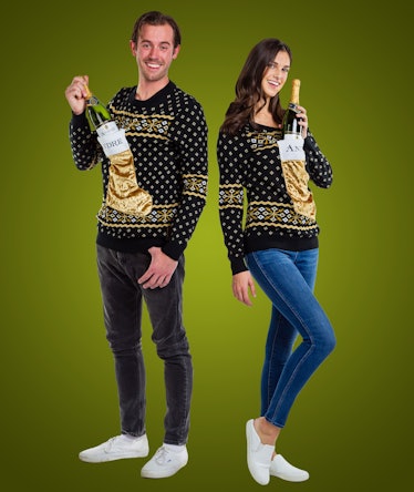 The André Champagne x Tipsy Elves 2019 Ugly Holiday Sweaters have stockings to put your bottle in.
