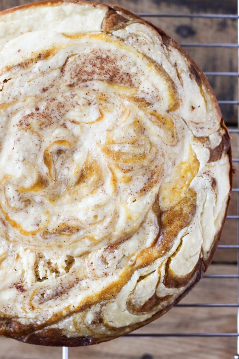Easy Thanksgiving dishes; slow cooker cream cheese swirl pumpkin bread on a wire cooling rack