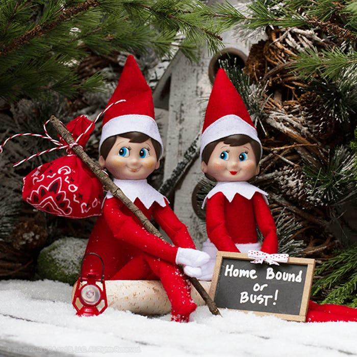 When Does Elf on the Shelf Start; two elves sitting by a Christmas tree in the snow with a sign read...