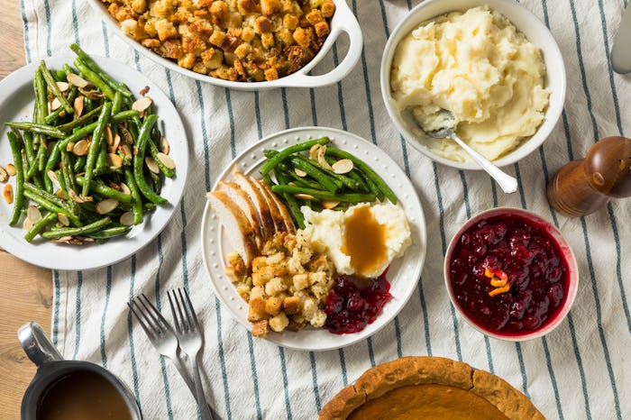 easy thanksgiving recipes; thanksgiving spread featuring cranberry sauce, mashed potatoes, and more