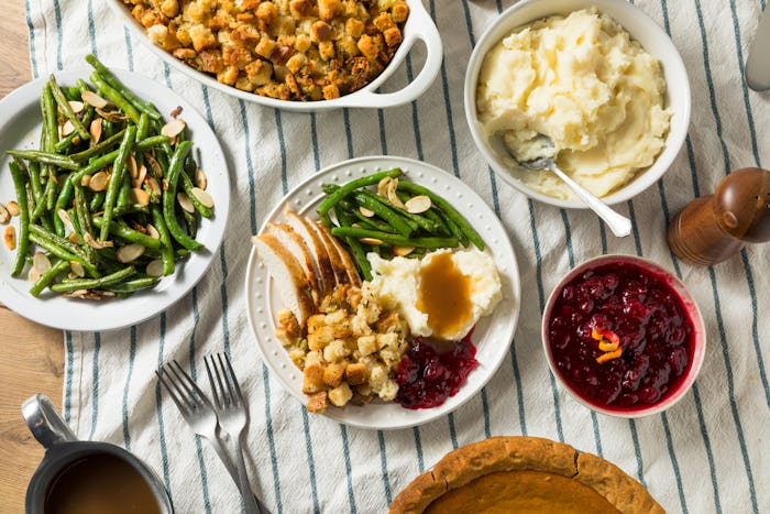 easy thanksgiving recipes; thanksgiving spread featuring cranberry sauce, mashed potatoes, and more