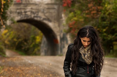 Girl walking in the fall, having a bad November day.