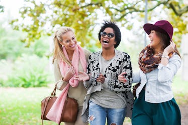 Women friends having best November fall day.