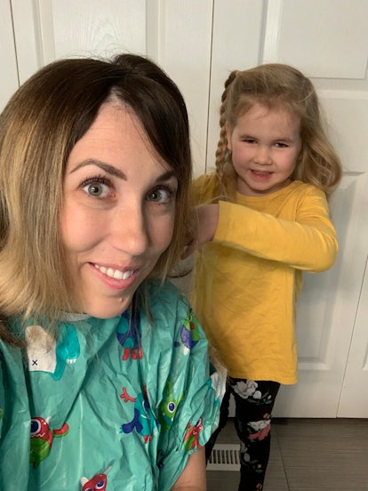 Mom receives haircut from toddler