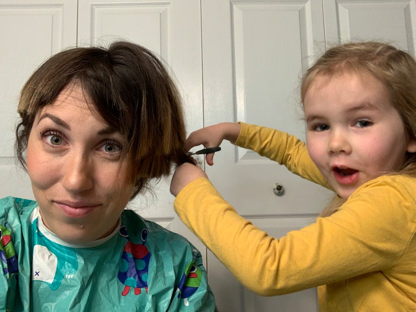 Mom receives haircut from toddler