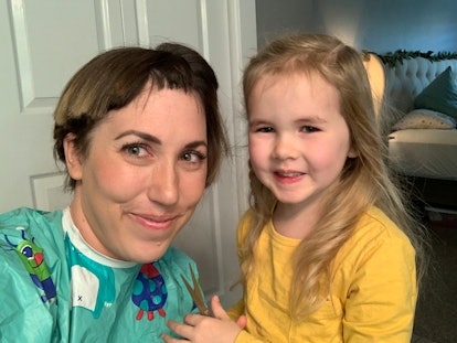 Mom receives haircut from toddler