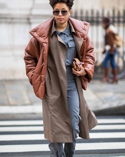 Street style photo of influencer at fashion week dressed in a layered winter outfit featuring Nanush...
