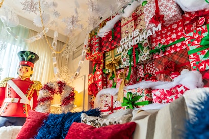 The 'Elf'-themed suite at Club Wyndham Midtown 45 has a wall of wrapped presents, a gigantic nutcrac...