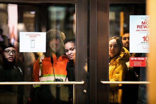 shoppers waiting outside of Macy's for Black Friday shopping