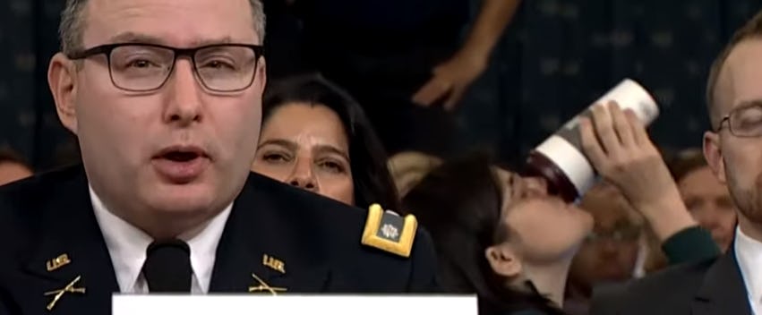 A woman chugging her coffee during the impeachment hearing has gone viral.