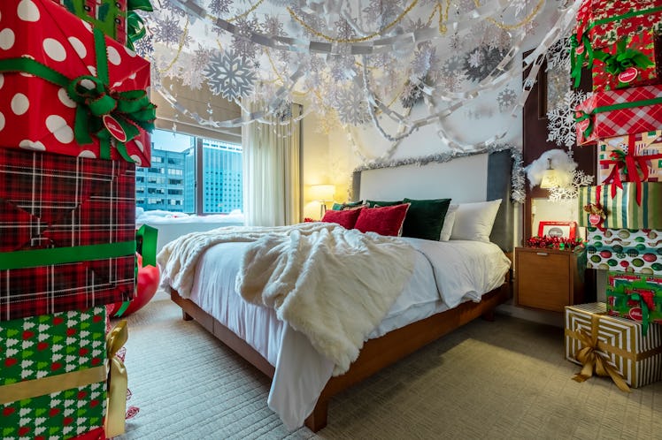 The 'Elf'-themed suite at Club Wyndham Midtown 45 features a wall of wrapped presents, television, c...