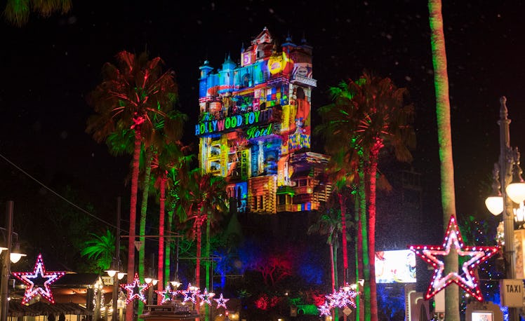 The Tower of Terror at Disney World lights up in multi-colored lights for the holiday season. 