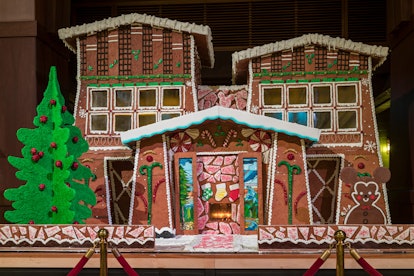 The giant gingerbread house sits in the Disney's Grand Californian Hotel lobby during the holidays. 