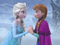 Anna and Elsa from 'Frozen' hold hands outside as it snows, inspiring some frozen quotes about siste...