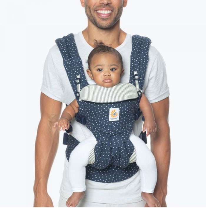 A dad wearing a baby in the Ergobaby Omni Baby Carrier All-in-one Galaxy