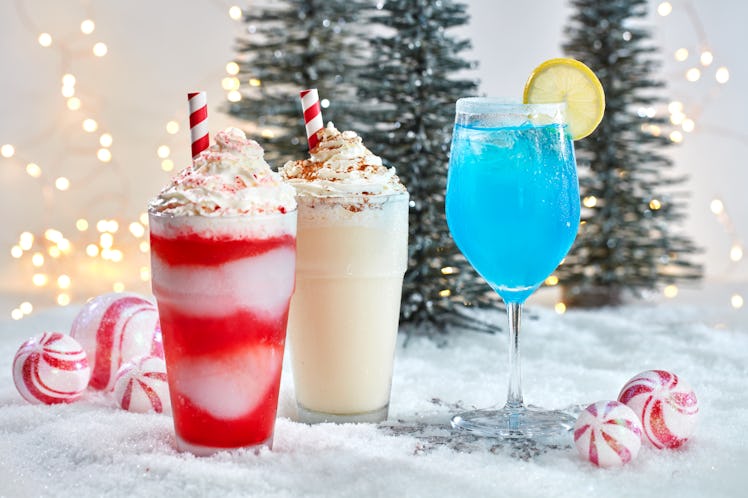 Frozen festive drinks sit on fake snow, and are available at Universal Orlando Resort's Holiday Cele...