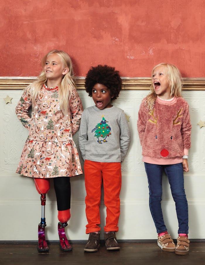 three kids wearing clothes from mini boden