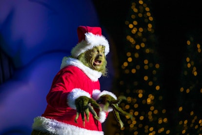 The Grinch stands in Seuss Landing during Universal Orlando Resort's Holiday Celebration. 