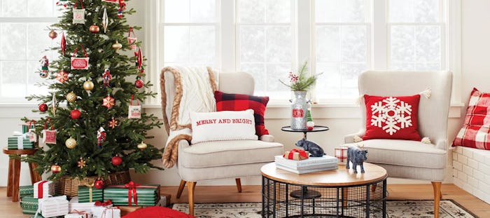 Target Holiday Decor Weekend Deal; neutral living room featuring bright red and green Christmas deco...