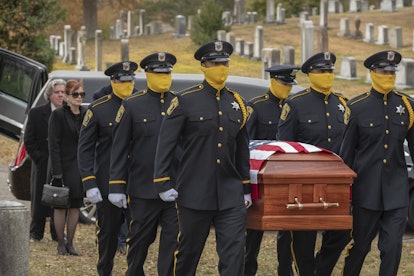 Masked cops at Judd Crawford's funeral in HBO's Watchmen. 