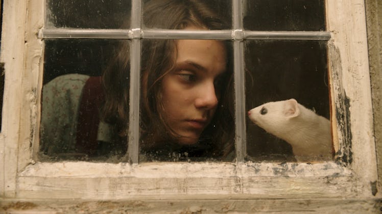 Dafne Keen as Lyra with her daemon, Pan, in His Dark Materials