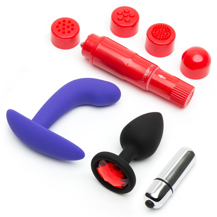 Picture of two pocket vibrators, a prostate massager in purple, and a black and ruby bejeweled butt ...