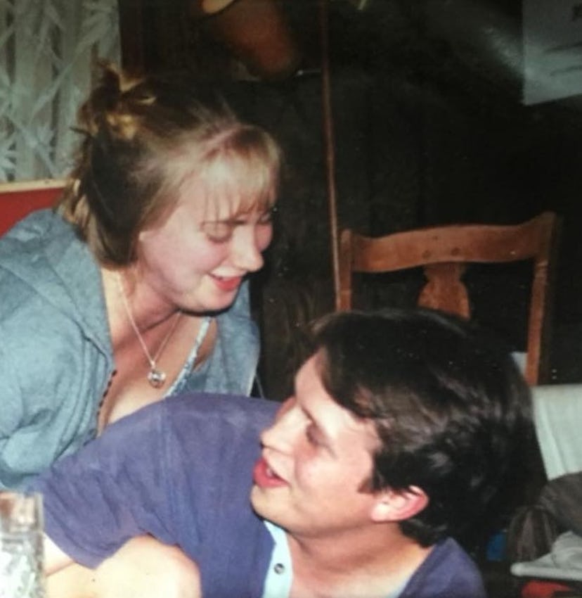 A picture of a man and woman laughing. 