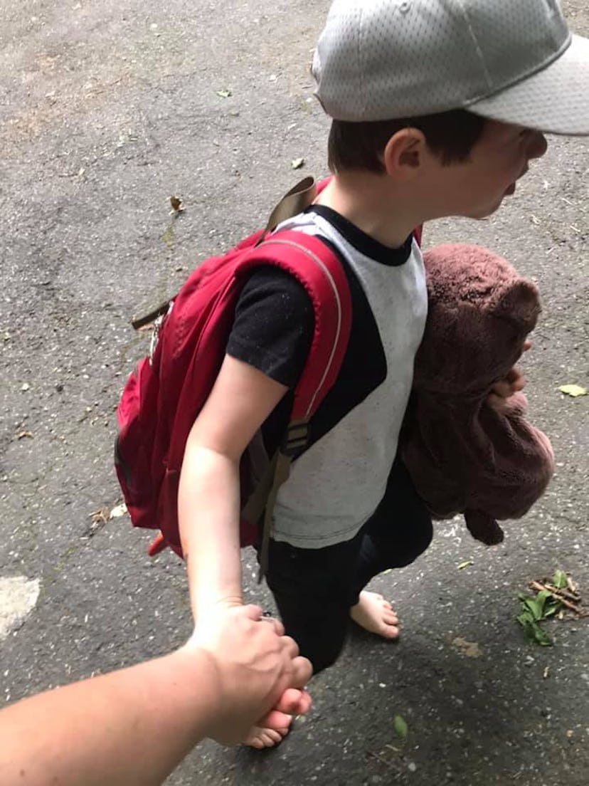 A picture of the author holding her son's hand. 