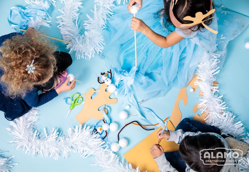 Three girls at Alamo Drafthouse, getting crafty at a Frozen 2 themed party