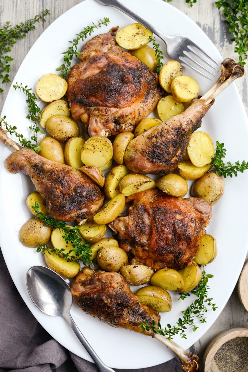 roasted sheet pan turkey and potatoes on white platter