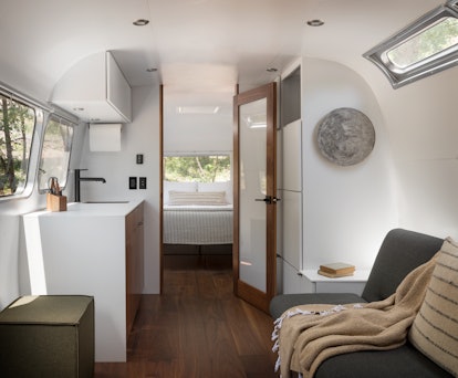 The interior of an AutoCamp airstream trailer is very luxe and decorated with nature-inspired detail...