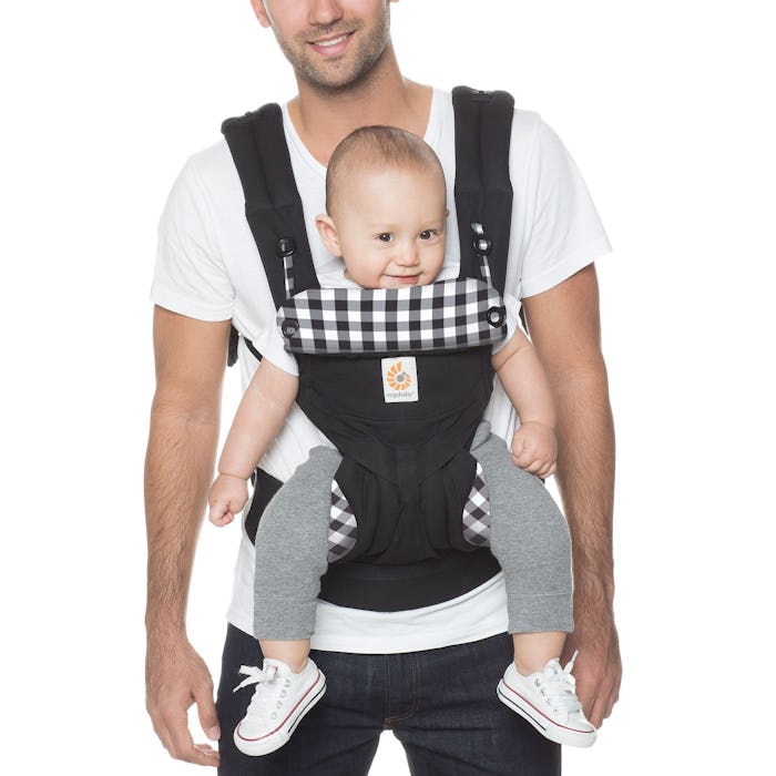 Dad holding baby in Ergobaby carrier