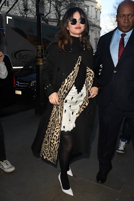 Selena Gomez's new bangs worn with slip dress and leopard trench