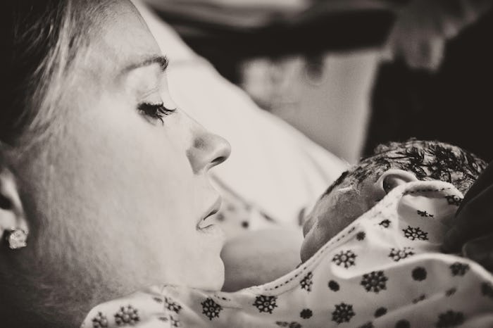 A mom holds her newborn