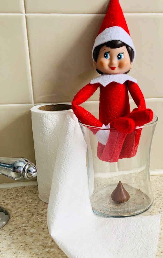 Elf on the Shelf pooping a Hershey Kiss