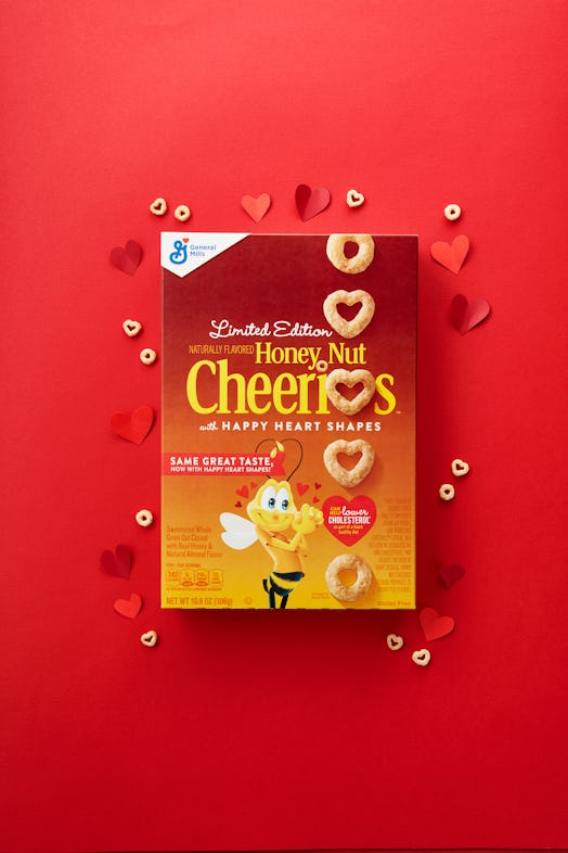 Heart shaped cheerios box on red background