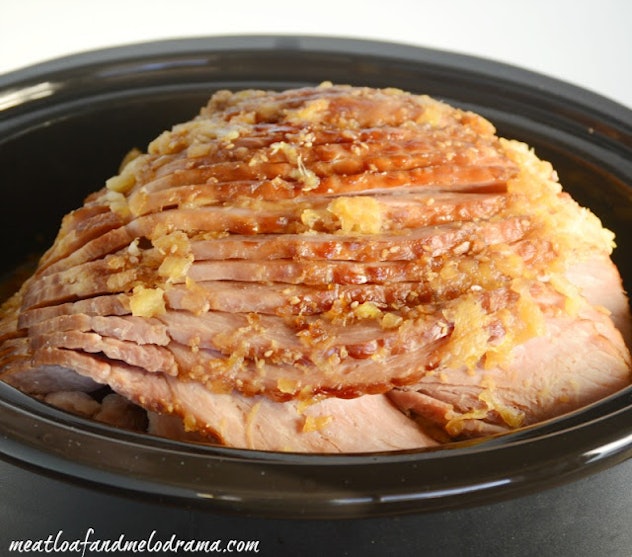 crock-pot full of sliced ham with chunks of pineapple on top