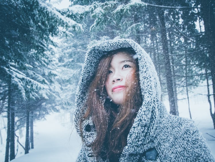 Asian girl in winter snow