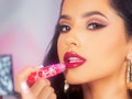 Singer Becky G models ColourPop's cherry-red Roller Gloss from her eight-piece Hola Chola collaborat...