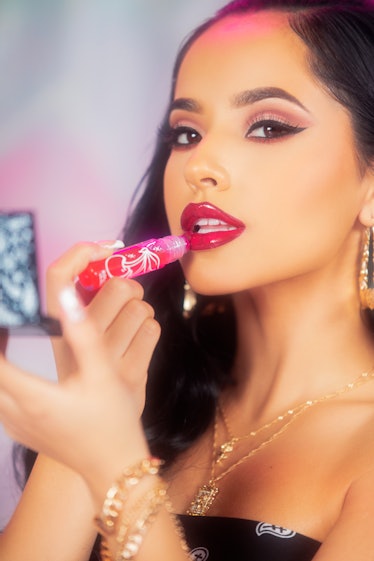 Singer Becky G models ColourPop's cherry-red Roller Gloss from her eight-piece Hola Chola collaborat...