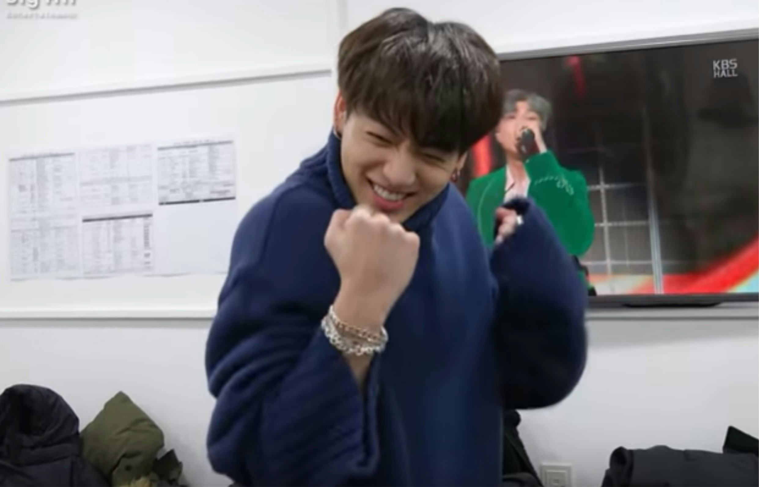 A screenshot from a video of BTS copying each other's solo dances.